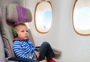 little boy watching tv in flight
