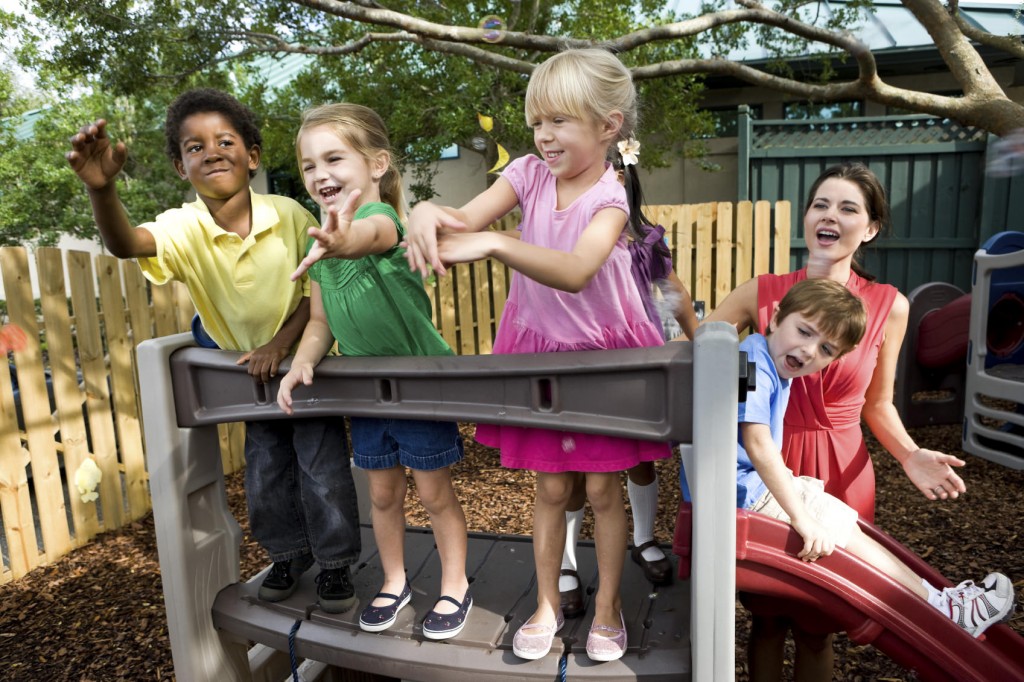 Diverse preschool children playing on playground
